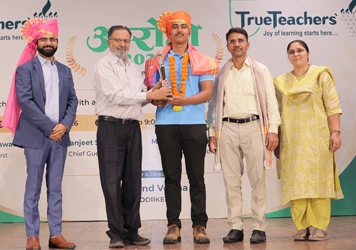 Students receiving academic achievement awards at TrueTeachers