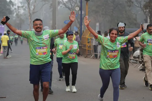 Marathon participants crossing the finish line in celebration