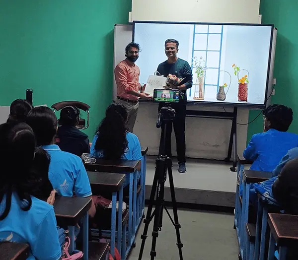Guest being felicitated with an award during the event