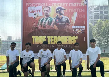 Students standing on the ground during True Teachers cricket tournament